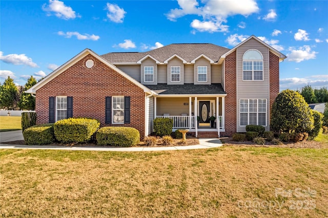 front of property with a front lawn and covered porch