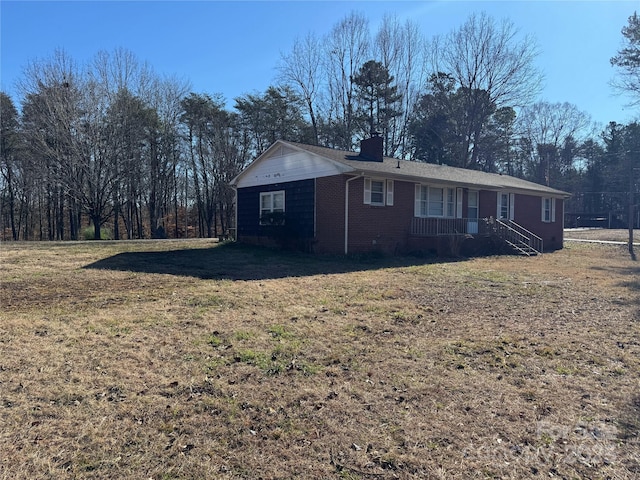 back of house featuring a yard