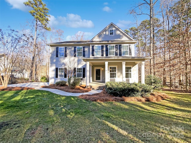 view of front of property with a porch and a front yard