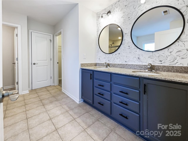 bathroom with tile patterned floors and vanity