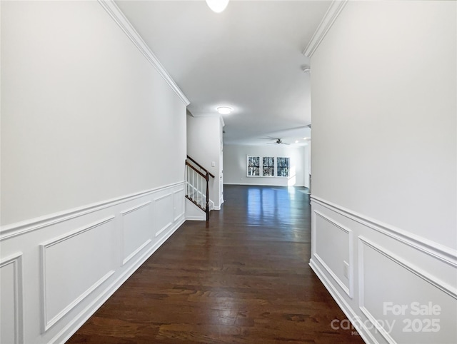 hallway featuring crown molding and dark wood-type flooring