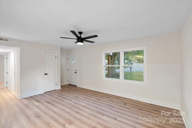 spare room with light hardwood / wood-style floors and ceiling fan