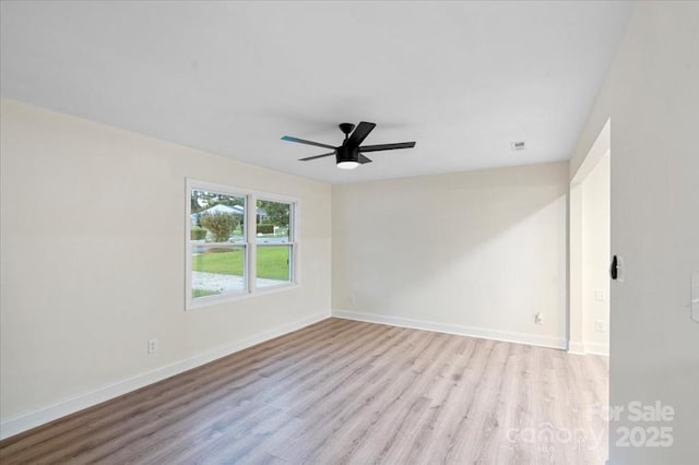 unfurnished room with ceiling fan and light wood-type flooring