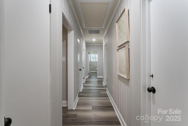 hall featuring dark hardwood / wood-style floors and crown molding