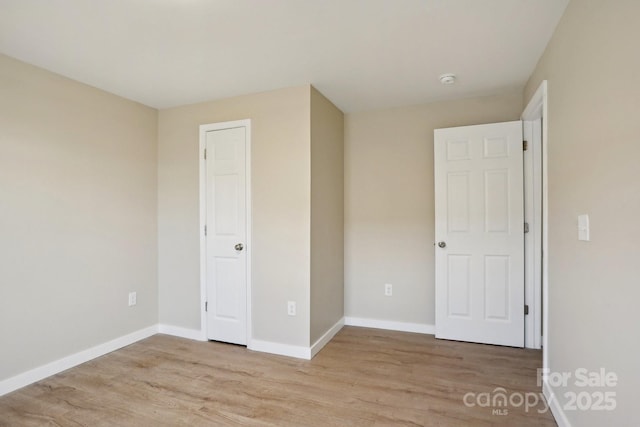 unfurnished bedroom with light hardwood / wood-style flooring