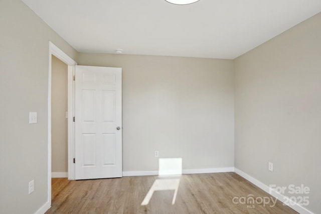 unfurnished room featuring light hardwood / wood-style flooring