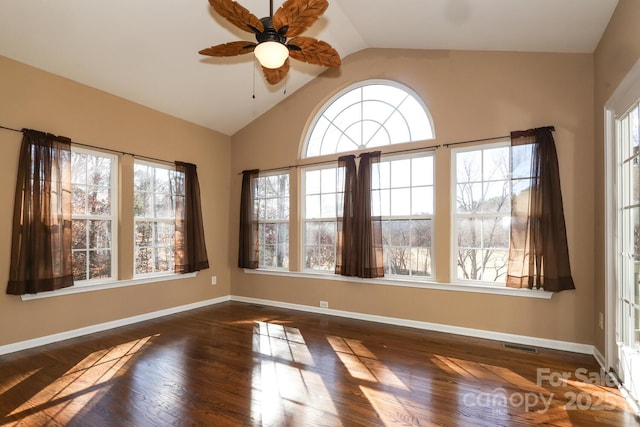 spare room with ceiling fan, dark hardwood / wood-style flooring, and lofted ceiling