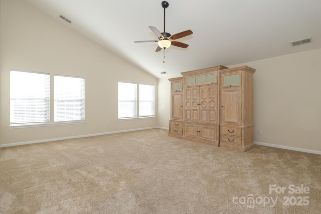 unfurnished bedroom with light carpet, high vaulted ceiling, and ceiling fan