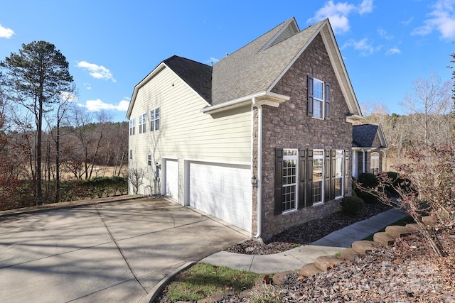 view of side of property featuring a garage