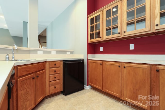 kitchen with dishwasher, black dishwasher, and sink