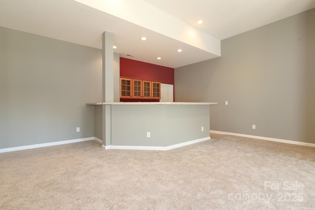 unfurnished living room with light carpet