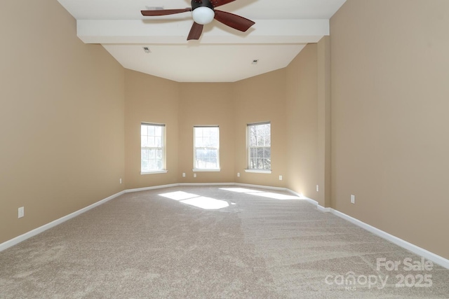 spare room with beam ceiling, light colored carpet, high vaulted ceiling, and ceiling fan