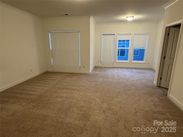 carpeted spare room with ornamental molding