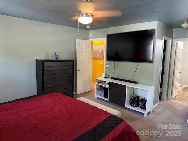 9624 Langston Mill Rd, Charlotte, NC 28216 - bedroom featuring baseboards, ceiling fan, and light carpet