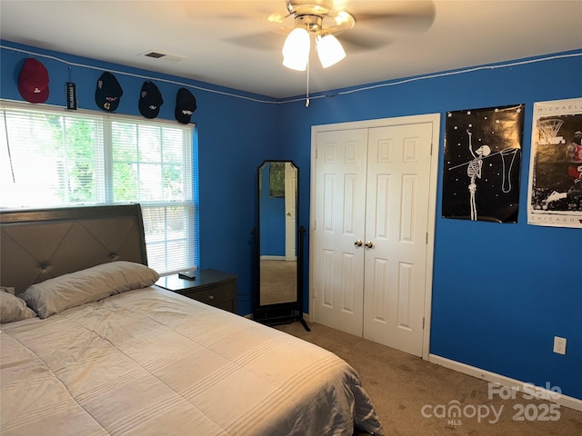 9624 Langston Mill Rd, Charlotte, NC 28216 - carpeted bedroom with baseboards, a ceiling fan, a closet, and visible vents