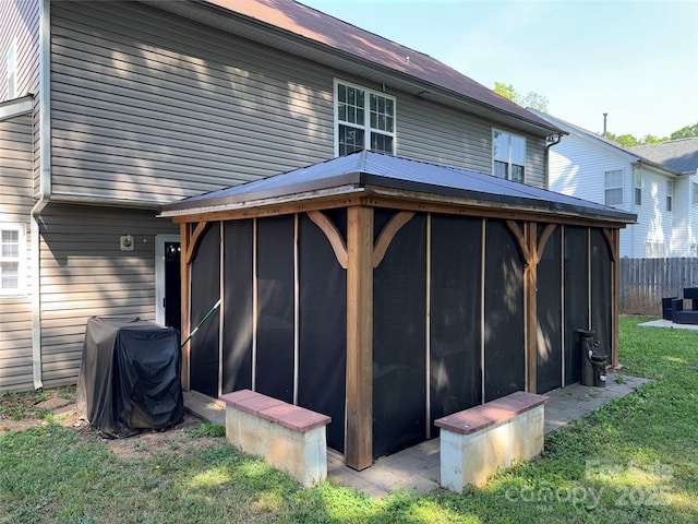 9624 Langston Mill Rd, Charlotte, NC 28216 - rear view of property with a sunroom, a lawn, and fence