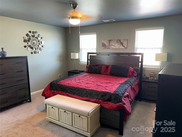 9624 Langston Mill Rd, Charlotte, NC 28216 - bedroom featuring light colored carpet, ceiling fan, visible vents, and multiple windows
