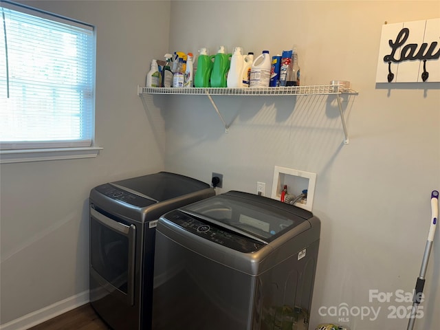 9624 Langston Mill Rd, Charlotte, NC 28216 - laundry area featuring washing machine and clothes dryer, dark wood-style flooring, laundry area, and baseboards