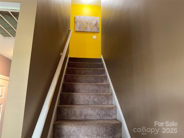 9624 Langston Mill Rd, Charlotte, NC 28216 - staircase with baseboards and visible vents
