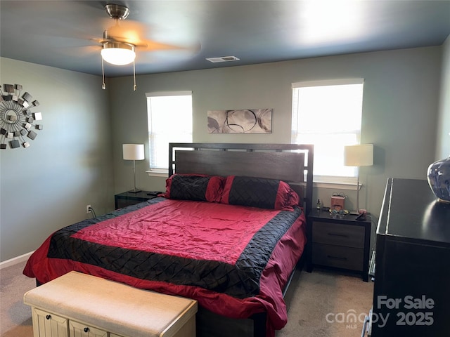 9624 Langston Mill Rd, Charlotte, NC 28216 - bedroom with visible vents, multiple windows, ceiling fan, and light colored carpet
