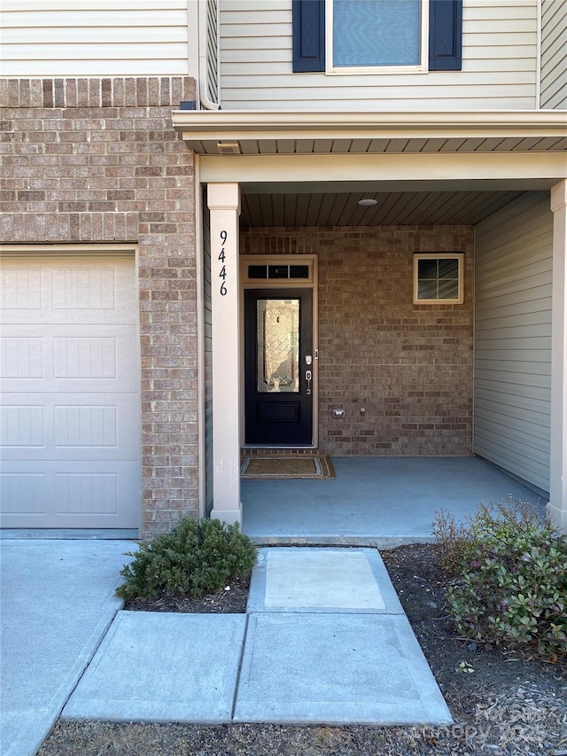 entrance to property featuring a garage