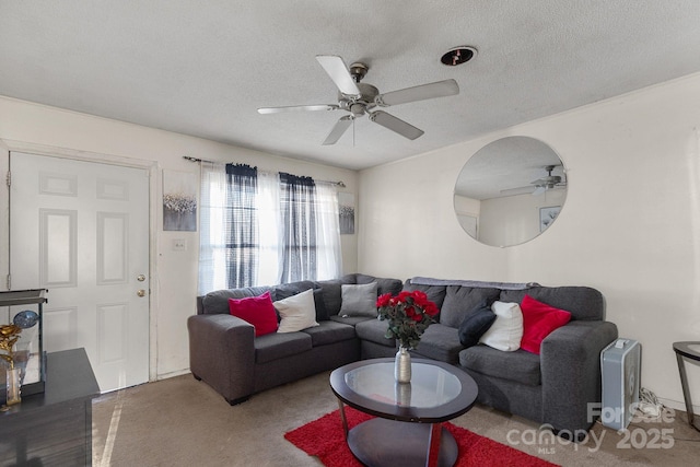 living room featuring ceiling fan and a textured ceiling