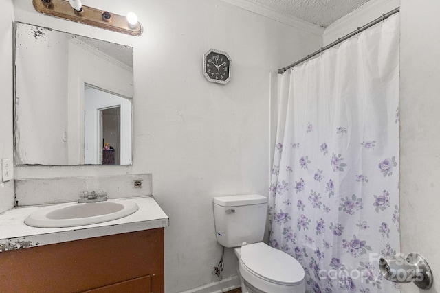 bathroom with vanity, crown molding, toilet, a textured ceiling, and walk in shower