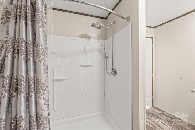 full bath featuring crown molding, a textured ceiling, and a shower with curtain