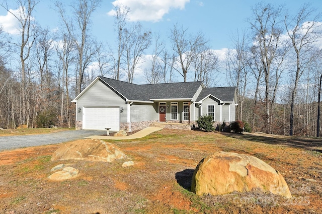 view of front of property featuring a front yard and a garage