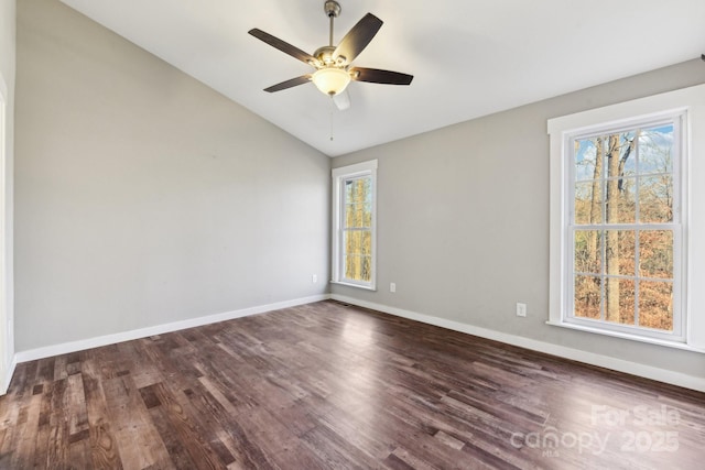 unfurnished room with ceiling fan, dark hardwood / wood-style floors, and lofted ceiling