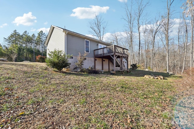 exterior space featuring a deck and a lawn