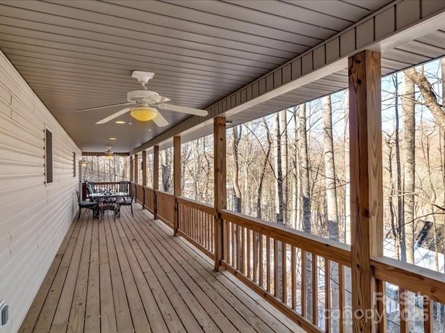 wooden deck featuring ceiling fan