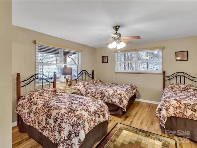 bedroom featuring ceiling fan and light hardwood / wood-style floors