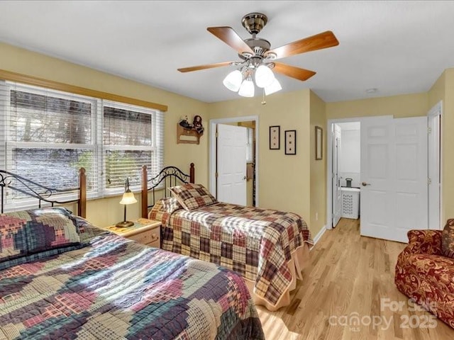 bedroom featuring light hardwood / wood-style flooring and ceiling fan