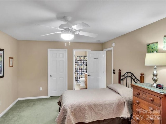 bedroom with carpet floors, ensuite bath, and ceiling fan