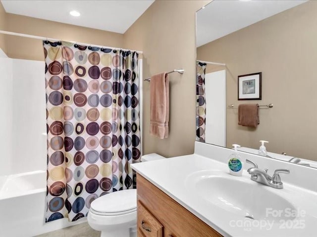 full bathroom with vanity, toilet, and shower / tub combo