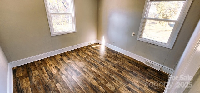 spare room with wood-type flooring