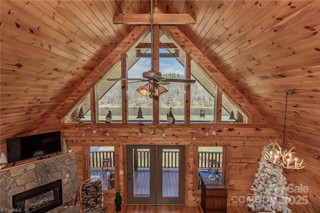 interior space featuring beam ceiling, high vaulted ceiling, and wooden ceiling