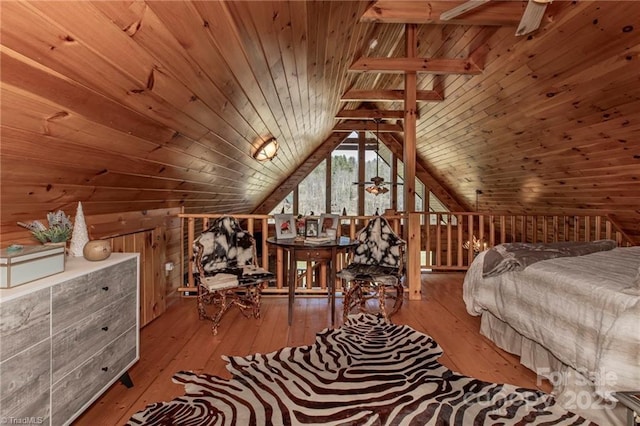 bedroom with wood walls, wooden ceiling, lofted ceiling, and light wood-type flooring