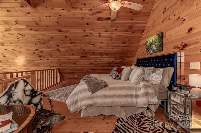 bedroom featuring wooden walls, ceiling fan, wood-type flooring, and vaulted ceiling