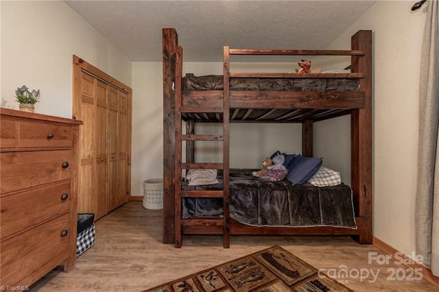 bedroom with light hardwood / wood-style flooring