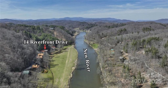 bird's eye view with a water and mountain view