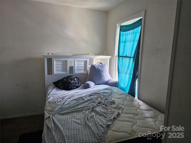 bedroom featuring a textured ceiling