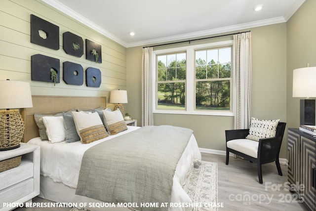 bedroom with ornamental molding and light wood-type flooring