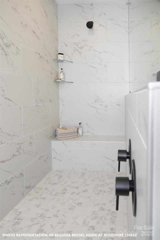 bathroom featuring a tile shower