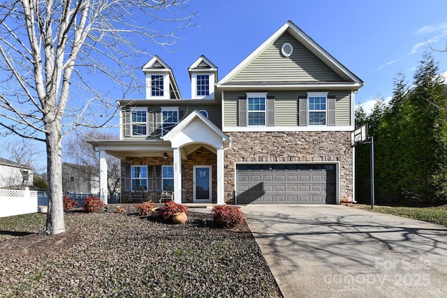 view of front of property featuring a porch and a garage