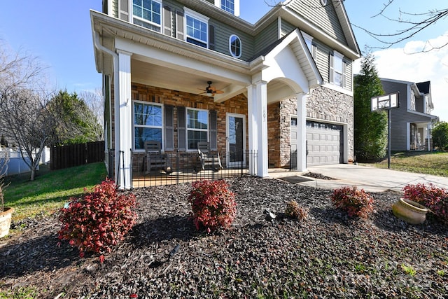 view of front of home featuring a porch and a garage