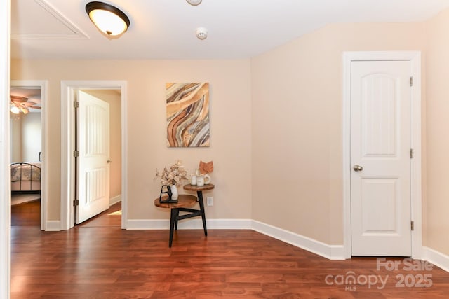 corridor with dark hardwood / wood-style flooring