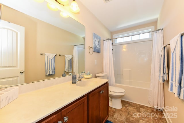 full bathroom with vanity, shower / bath combination with curtain, and toilet