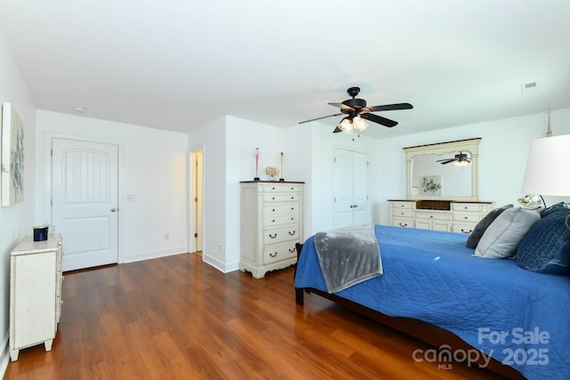 bedroom featuring dark hardwood / wood-style flooring and ceiling fan